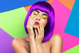 Model in creative image with pop art makeup
