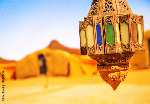 coloreful berber lamp with traditional nomad tents on background © Goodpics