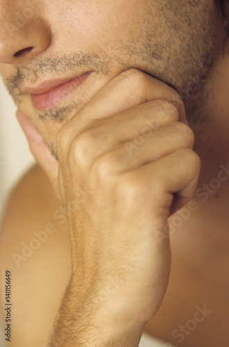 Poster Man resting his Chin with one Hand - Three-Day Beard - Masculinity