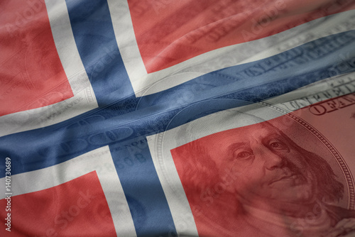 Poster colorful waving national flag of norway on a american dollar money background
