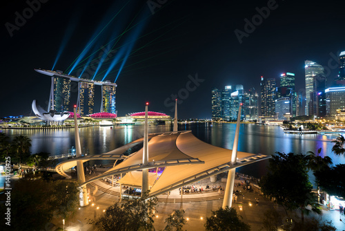 Obraz na plátne Colorful Singapore skyscraper building and laser show in night at Singapore