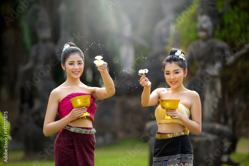 Poster Laos girls splashing water durin tradition festival Laos Vientiane, Songkran fes