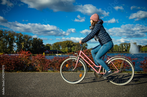 Girl biking in city 