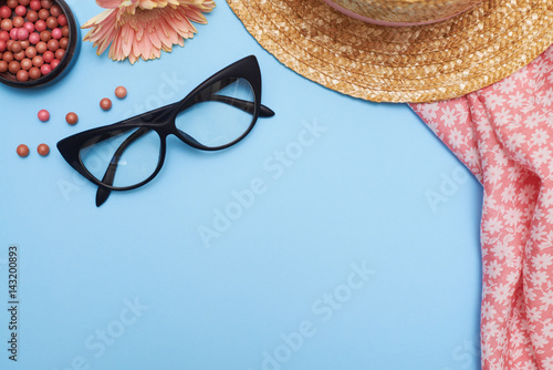 Poster Woman accessories, clothes and cosmetics on blue background, flat lay