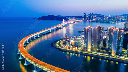 Busan Gwangandaegyo Bridge or GwangAn Bridge and Haeundae aerial view at night, Busan, South Korea.