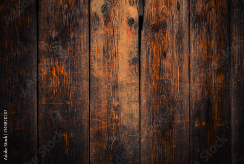  Old rural wooden wall in dark brown and orange colors, detailed plank photo texture. Natural wooden building structure background.