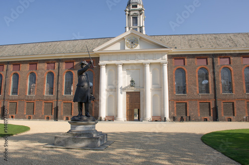 Poster Frontage of Royal Chelsea Hospital with pensioner statue in foreground