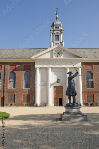 Poster Front of Royal Chelsea Hospital with pensioner statue at entrance