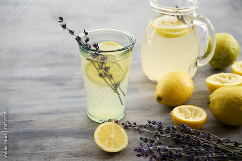 Lemonade with lemons and lavender on gray  shabby table
