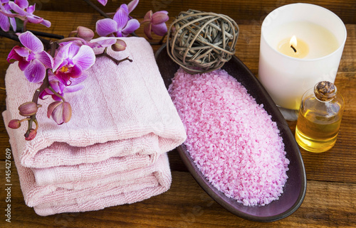 Poster Spa still life with orchid flowers, towels,salt, scent candle and oil bottle