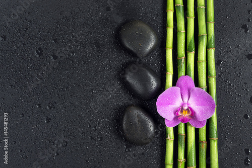  Spa concept with zen stones, orchid flower and bamboo