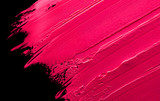 Smudged lipstick pink on a black isolated background