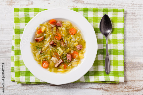 Homemade cabbage soup, cooked on smoked ribs.