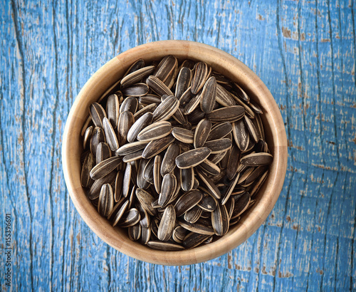 Sunflower seeds in wood bowl
