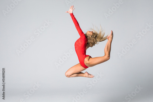 Poster beautiful gymnastic or dancer woman posing on white isolated background