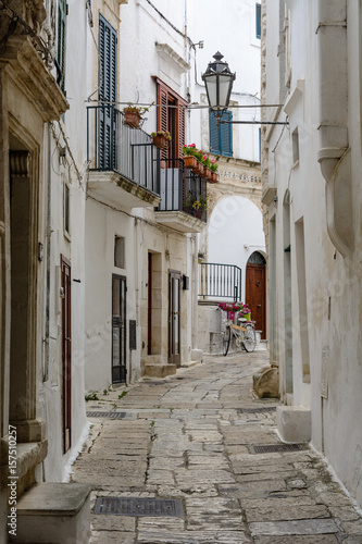Fototapeta A narrow alley in Ostuni, Puglia, Italy
