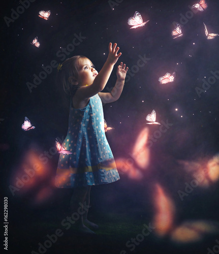 Litter girl chasing butterflies