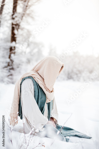 Jesus Christ kneels in the snow to pray | Buy Photos | AP Images