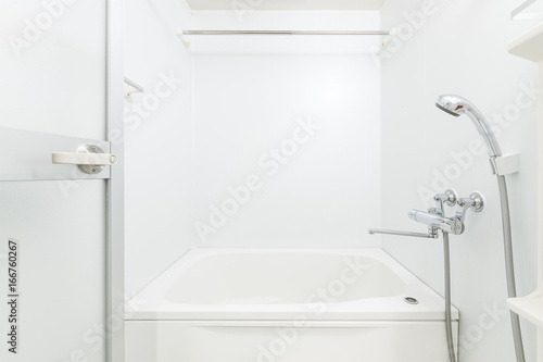 Fototapeta New white bathroom with bathtub and shower
