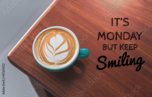 Inspirational quote with hot coffee cup on wooden table background with vintage filter.