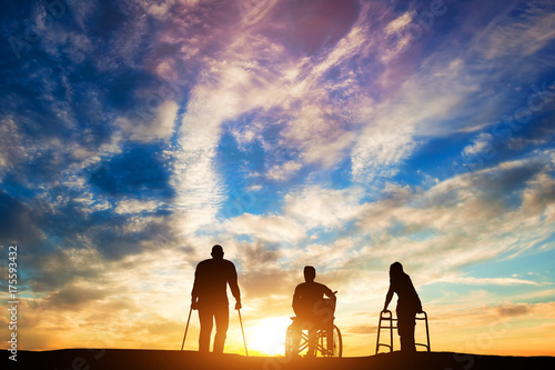 Three disabled people at the sunset. © Photocreo Bednarek