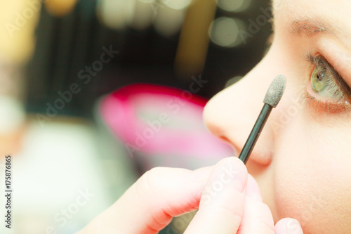 Close up woman getting make up, eyeshadow Tableau sur Toile