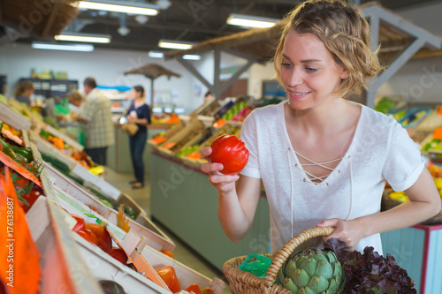 happy female buying fruits in the market