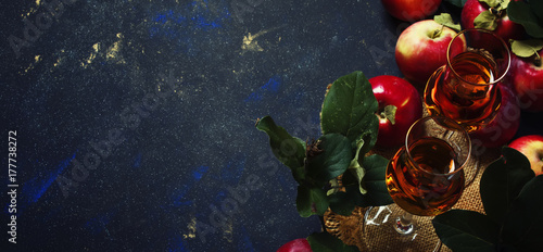 Apple brandy, dark background, top view