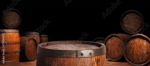 Rustic wooden barrel on a night background