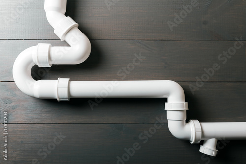white plastic sewerage water pipes © ronstik