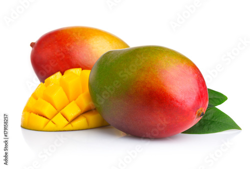 Ripe mango fruits with slices isolated on white © Serhiy Shullye