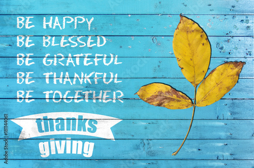 Happy thankgsgiving day with design poster on blue wooden texture © bennian_1
