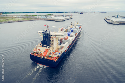 Aerial view of container ship going to port