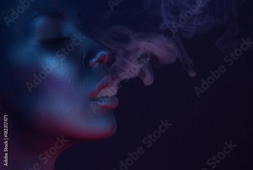 Vape Party, Nightlife. Beautiful Sexy Woman smoking