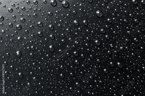 water-drops-on-a-black-surface-abstract-background