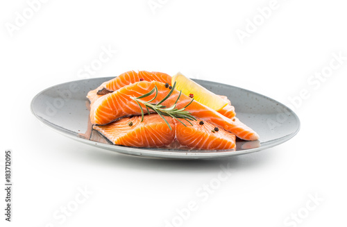 Obraz Fotograficzny Salmon. Raw salmon steaks herb peper lemon on white background.