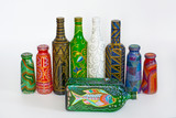 many different bottles, painted dot painted on isolated background. 