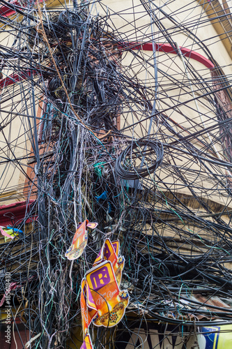 KOLKATA, INDIA - OCTOBER 31, 2016: Chaotic mess of wires in the center