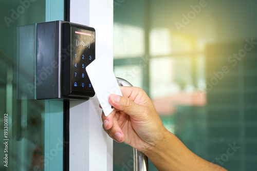 Close Up Hand Inserting Keycard To Lock And Unlock Door