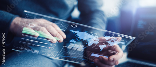 Man with futuristic digital tablet