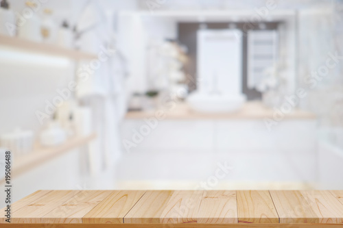 Top wood table for product display montage with bath room background. © bongkarn