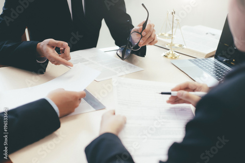 Law, advice and Legal services concept. Lawyer and attorney having team meeting at law firm.