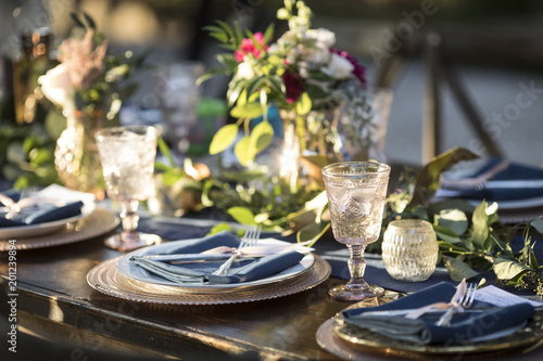 Vintage table setup for outdoor wedding reception. © Wollwerth Imagery