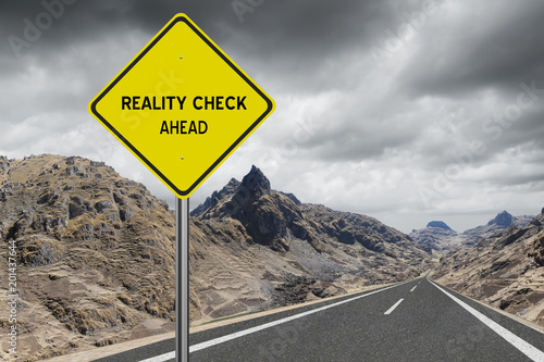 Reality Check Ahead sign