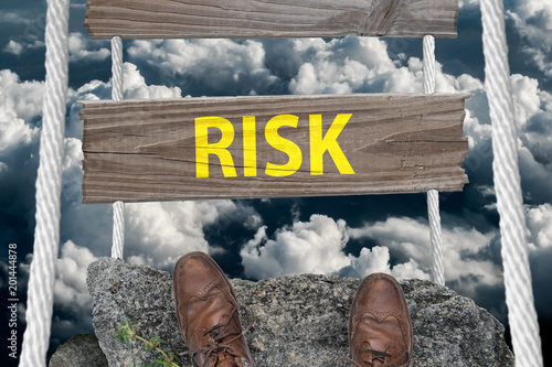 Challenging bridge with text Risk