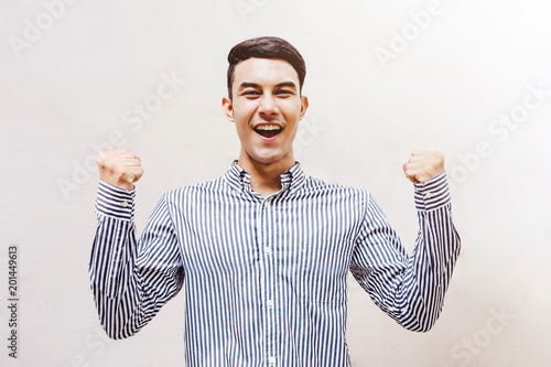 Young and Happy Businessman in Cheerful posture to Celebrate his Success Life, Successful and Business Achievement concept
