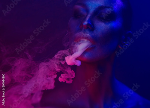 Vape Party, Nightlife. Beautiful Sexy Woman smoking