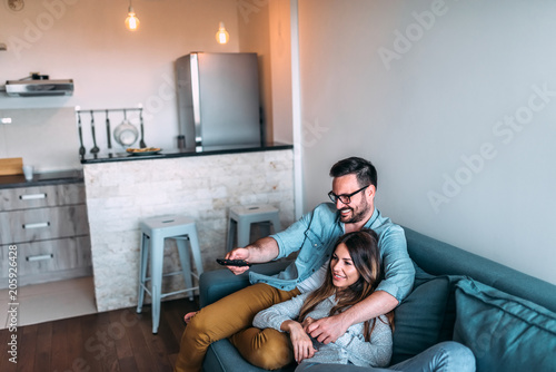 Young couple watching tv.