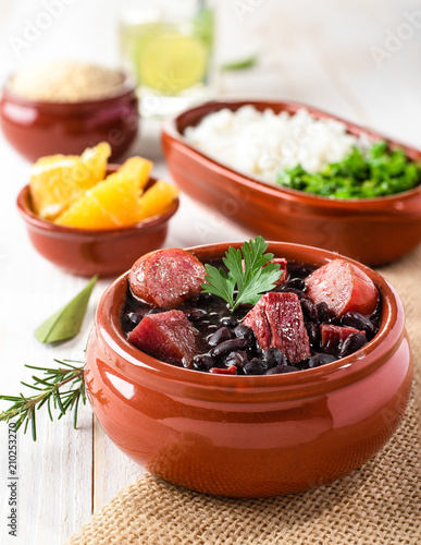 Feijoada (bean stew) - Brazilian Traditional Food (Dry Beef, Cabbage, Orange, Rice, Beans) © trafa