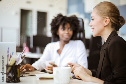 Female colleagues talking.